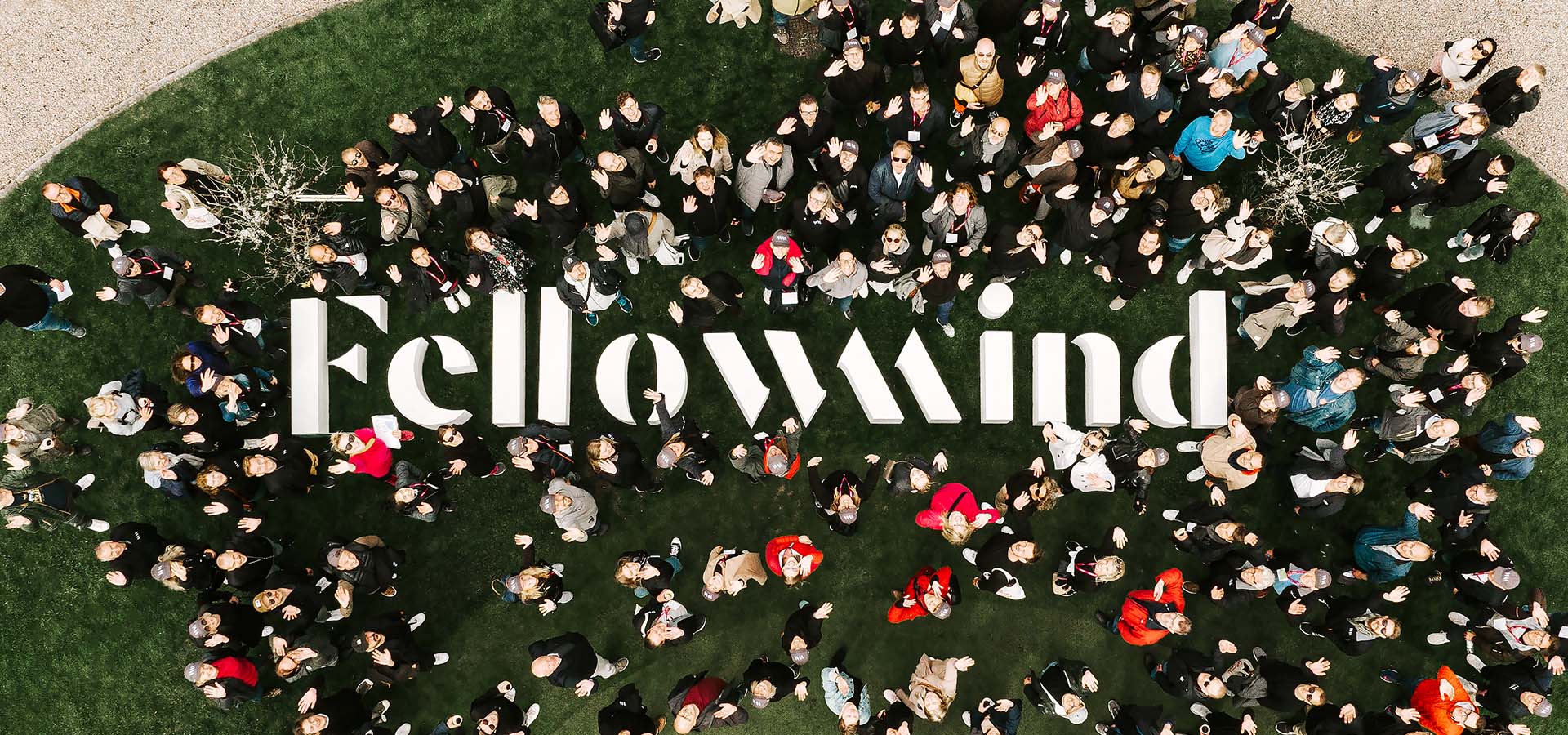 people around a fellowmind logo